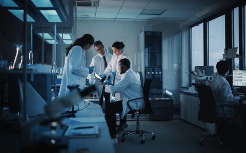 Medical Science Laboratory with Diverse Multi-Ethnic Team of Microbiology Scientists Have Meeting on Developing Drugs, Medicine, Doing Biotechnology Research-CREDIT_istock-1293772951