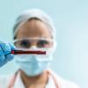 lab holding vial blood - CREDIT - iStock-1266993064