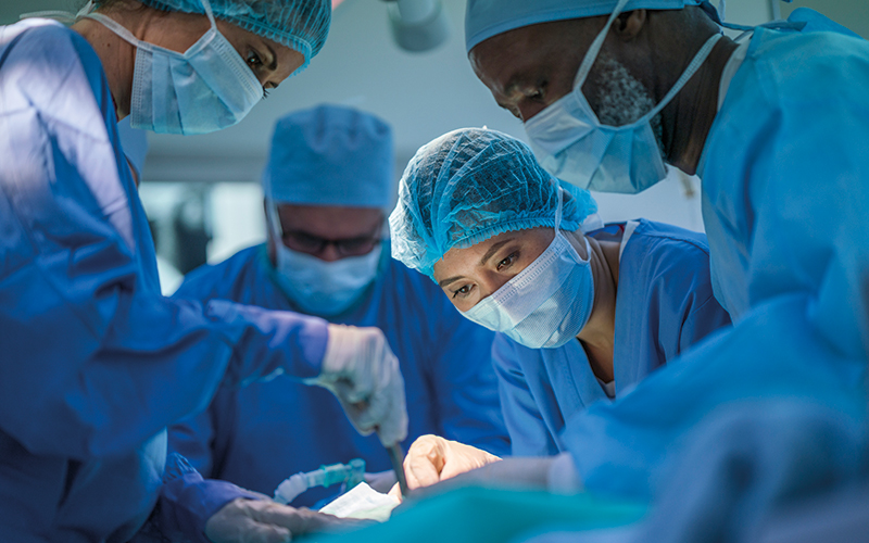 Healthcare workers performing surgery at hospital - Image credit | iStock-1145212202